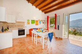 Villa Rosa dei Venti in Sicily for Rent | Living room with table and kitchen