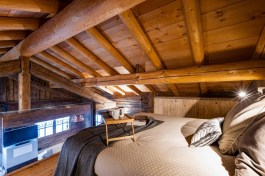 Luxury Chalet Lusia in Dolomites for Rent | Bedroom on galery