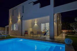 villa shamsi, swimming pool, night