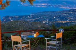 Villa Conchiglia in Sicily for Rent | Sunset and sea view with glass of vine