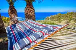 Villa Gabbiano in Sicily for Rent | Hammock in the garden with the sea view